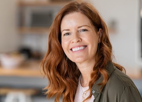 Red haired woman smiling
