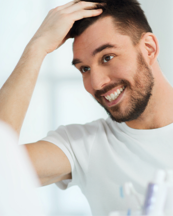 Photo of a happy man after PRP hair restoration treatments